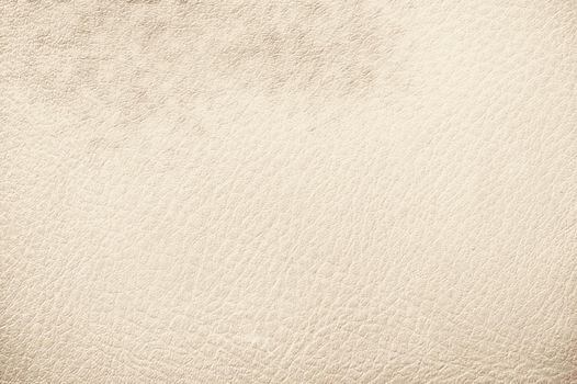 Cream color leather background texture. Close up wallpaper