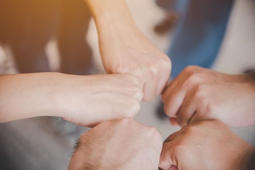 Business partnership giving fist bump to Start up new project. Business and Teamwork of Partnership concept. Corporation meeting in company or industrial work concept. selective focus on hand
