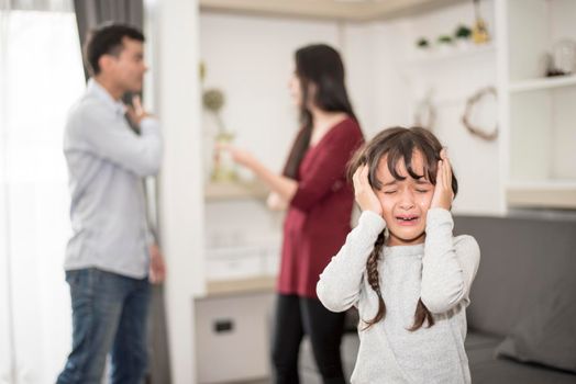 Little girl was crying because dad and mom quarrel, Sad and dramatic scene, Family issued, Children's Rights abused in Early Childhood Education and Social and parents care problem concept