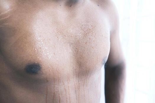 young man skin sweating in chests