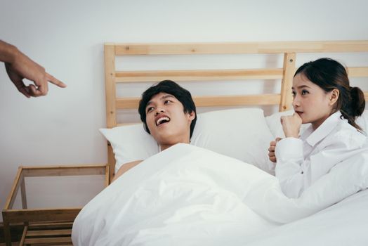 Asian adulterer and his unfaithful wife are indicated by marriage certificate husband. Paramour and divorce concept. Social problem theme. Asian people