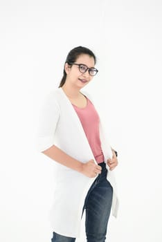 Asian woman posing with casual outfit and eyeglasses in happy mood on white isolated background. People beauty and portrait concept.