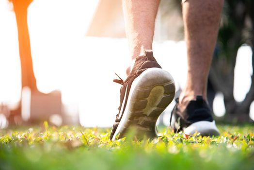 Sport man warm up to jogging at park. Exercise and Outdoors concept. Healthy activity and Lifestyle theme.