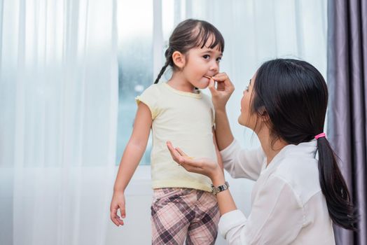 Mom feeding kids with potato chip. Teacher feeding student with snack. Back to school and Education concept. Children and kids theme. Home sweet home and Nursery theme.