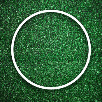 Circular white frame edge on green grass with shadow background. Decoration background element concept. Copy space for text insert in filled in black space.