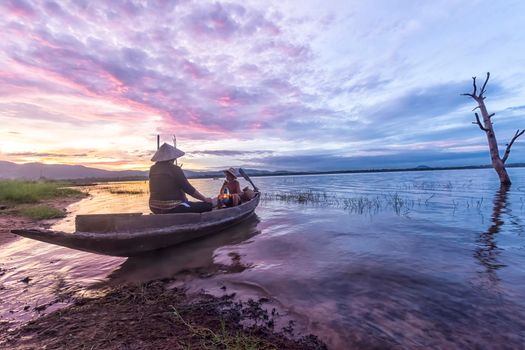 Fisherman grandfather and grandson fishing on the boat, Family and Nature culture concept