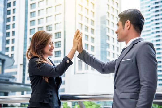Businessman and business woman doing high five, Business concept, Successful concept, Cooperation concept
