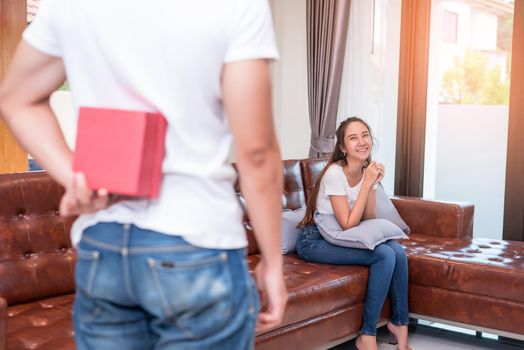 Man surprising woman in special day. Family and Lovers concept. Birthday and Valentine theme.