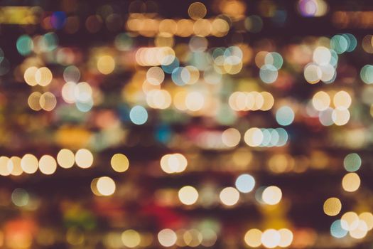 Blurry background of night market. Abstract and Decoration lighting concept. Christmas and New year theme.