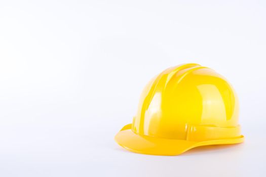Yellow safety helmet on white background. Hard hat isolated on white. Safety equipment concept. Worker and Industrial theme.