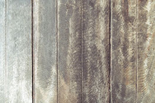 Closeup of old brown wooden plank texture background. Wallpaper backdrop. Abstract wood floor and wall structure. Top view angle. Vertical pattern