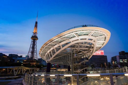 OASIS21 and NAGOYA TOWER at NAGOYA,JAPAN - 09 April,2016 : Many people and attraction building and department store shopping center in the night life.