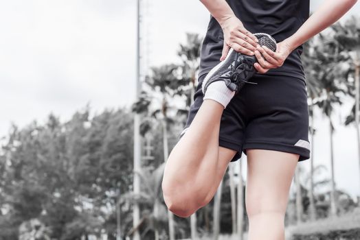 Runner stretching warm up before exercise, Sport and activity concept