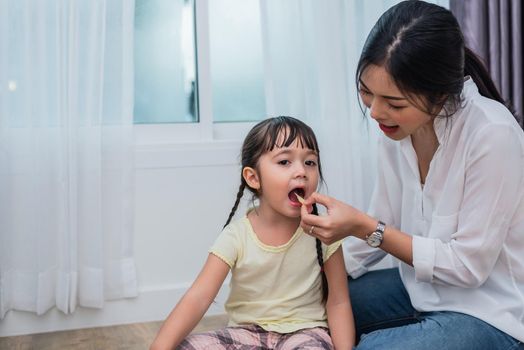 Mom feeding kids with potato chip. Teacher feeding student with snack. Back to school and Education concept. Children and kids theme. Home sweet home and Nursery theme.