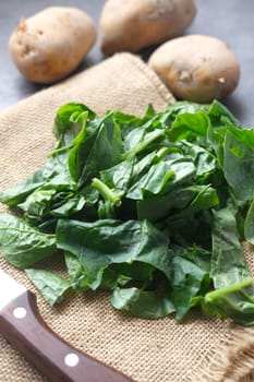 Fresh spinach leaves on table