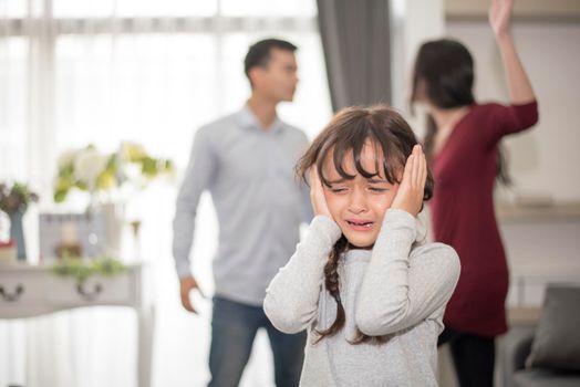 Little girl was crying because dad and mom quarrel, Sad and dramatic scene, Family issued, Children's Rights abused in Early Childhood Education and Social and parrents care problem concept