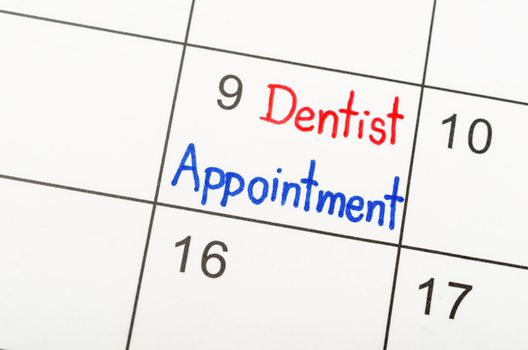 Dentist appointment wirting calendar to remind you an important appointment.