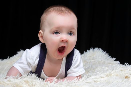 Little cute baby yawns. Cute baby. Four month old boy.