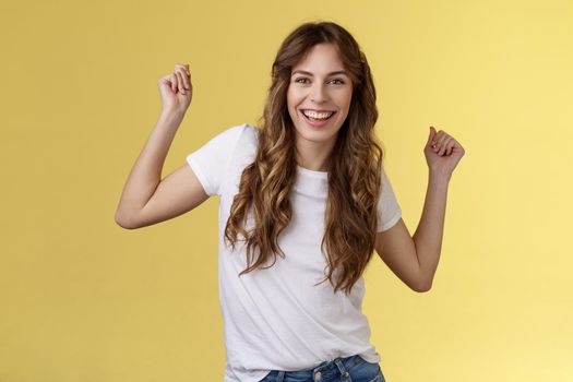 Oh yes check out my moves. Cheeky stylish good-looking young woman having fun party all night smiling delighted dancing lift hands up fist pump celebration success gesture grinning satisfied.