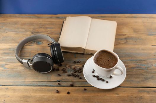 open book with blank pages next to cup of coffee on wooden table. ready for adding text or mockup