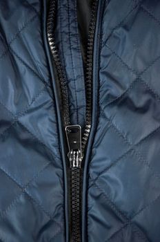 Detail of locking zipper on jacket. Close up macro local focus shot.