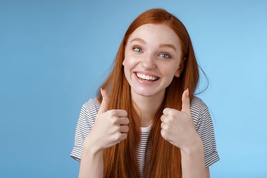 Nice idea keep up. Supportive tender cute european ginger girl blue eyes cheering friend boost mood show thumbs up smiling approval like good choice, agree interesting suggestion, satisfied.