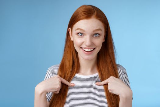 Surprised glad impressed excited redhead girl blue eyes stare camera fascinated cannot believe win pointing herself questioned amused getting nominated first place, picked receive scholarship.