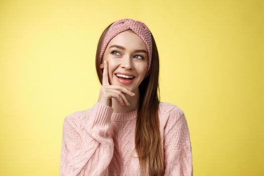 Girl having great idea, smirking delighted, proud herself, touching cheek smiling amused creating plan in mind looking at upper left corner pleased, intrigued and excited seeing awesome opportunity.