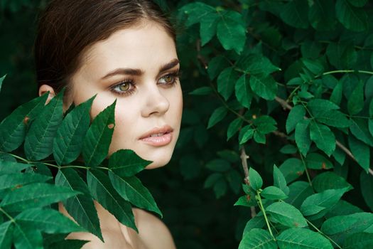 beautiful woman green leaves clean skin nature summer Lifestyle. High quality photo