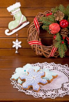 Homemade gingerbread cookies, festive Christmas and New Year sweets in the form of blue snowflakes