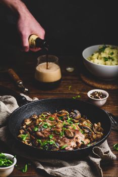 Fried pork neck steak with different mushrooms and mashed potatoes