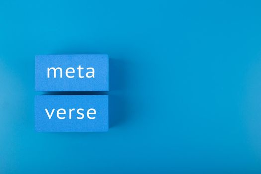 Metaverse modern minimal concept in dark elegant blue colors. Written metaverse single word on blue rectangles against blue background. Innovational future computer technologies.