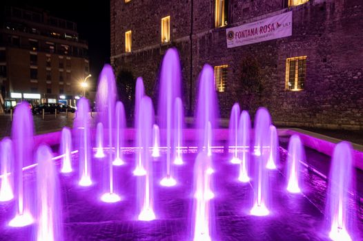 terni,italy october 12 2021:fountain of the town of terni illuminated in pink
