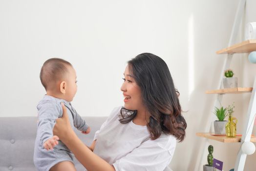 Happy smiling mother and baby