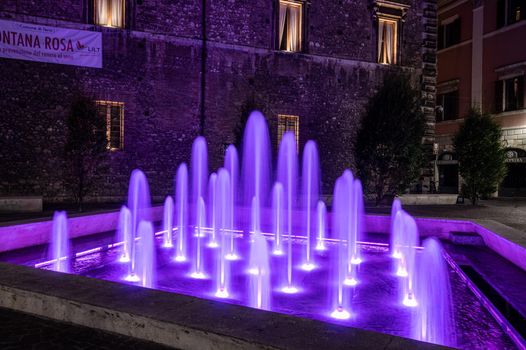 terni,italy october 12 2021:fountain of the town of terni illuminated in pink