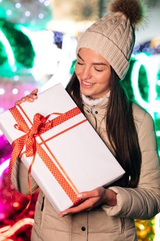 Portrait of happy young woman christmas present boxes