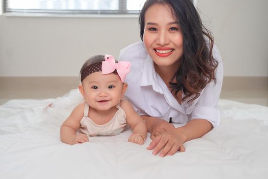 Happy smiling mother and baby