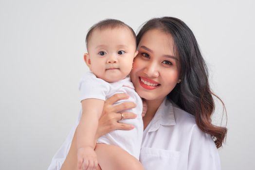 happy family mother playing and hug with baby daughter