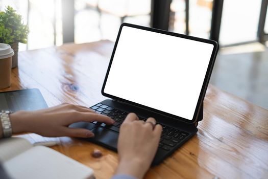 business woman typing on digital tablet keyboard. Blank screen for your advertising