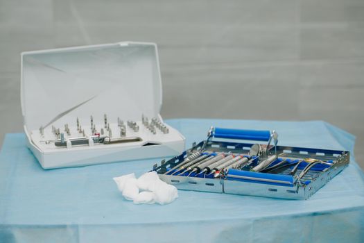 Dental implantation surgical set. Surgical kit of instruments used in dental implantology. Dentist orthopedist tools. Dentistry.