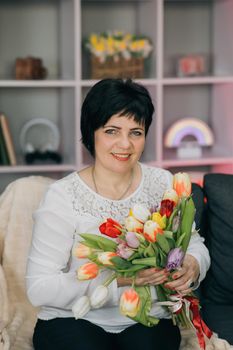 Portrait of woman holding flowers in her hand