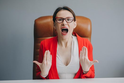 Upset business woman blogger vlogger influencer sit at home speaking looking at camera talking make video chat. Conference call record lifestyle blog vlog.