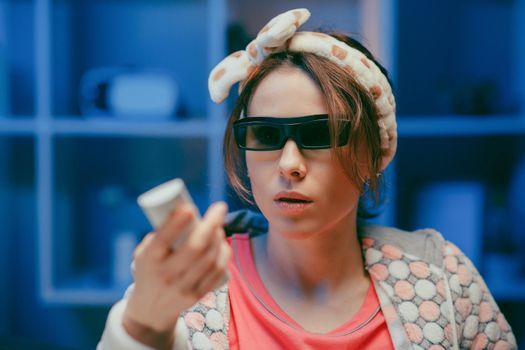Cheerful woman in 3d glasses eating popcorn. Fun young woman in 3d glasses watching movie film, eat popcorn. People sincere emotions in cinema, lifestyle concept.