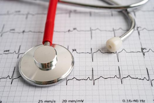 Stethoscope on electrocardiogram ECG, heart wave, heart attack, cardiogram report.