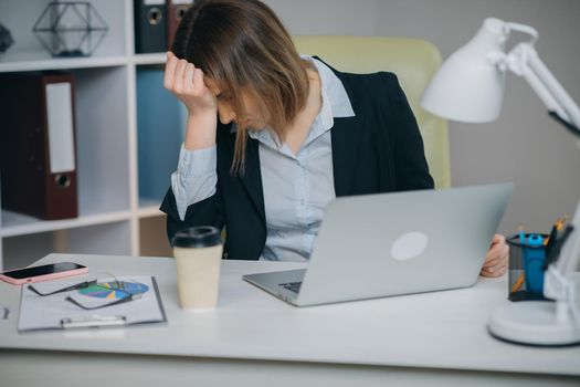 Tired Woman in Glasses Sitting at the Laptop Computer while Working in the Office, then Almost Falling Asleep and Waking Up