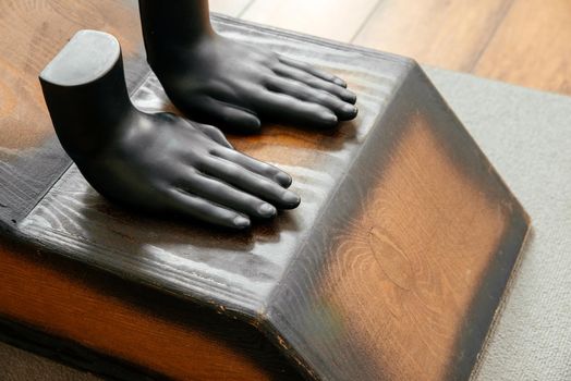 Yoga proffesional equipment, wooden bench and stool on the floor in yoga studio. Yoga and health concept