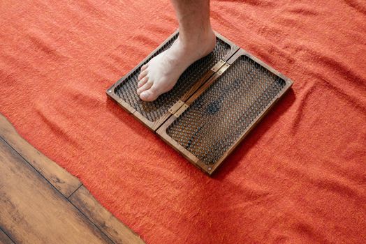 Board with sharp nails, Sadhu Board. yoga practice. Yoga and health concept