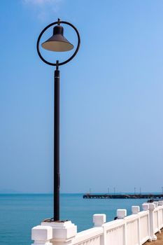 Lantern on a sea pier in Thailand. Travel and tourism.