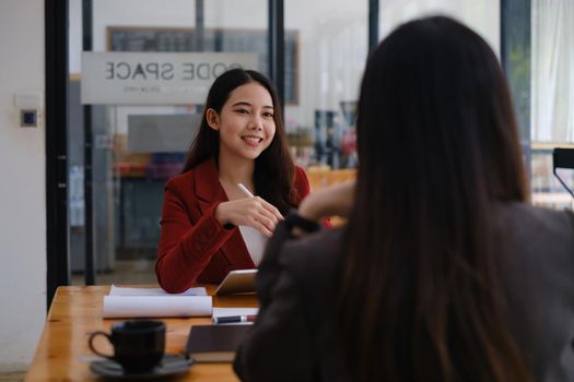 During a job interview, Woman in a suit and gives a presentation about herself