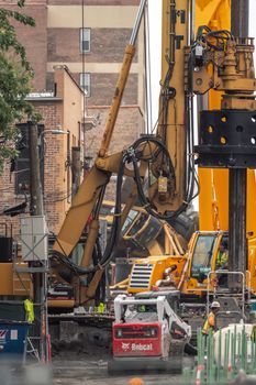 Chicago, IL - October 6th, 2021: A construction crane lays tipped upside down after an accident while doing work near the Bryn Mawr CTA train station and tracks Wednesday afternoon.